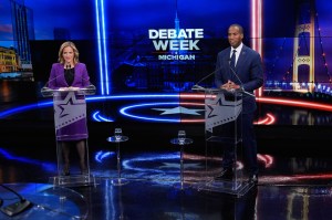 Michigan Secretary of State Jocelyn Benson (D) and U.S. Rep. John James (R) debate at WOOD TV8's Grand Rapids Tuesday, Oct. 6 in hopes to become the state's next governor. (AP Photo/Paul Sancya, Pool)