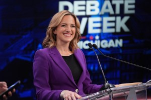 Michigan Secretary of State Jocelyn Benson, a Democrat, and U.S. Rep. John James, a Republican, debate at WOOD TV8's Grand Rapids Tuesday, Oct. 6. (AP Photo/Paul Sancya, Pool)