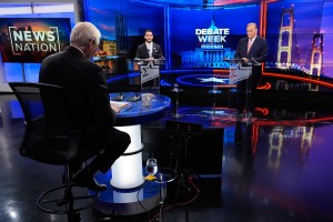 Moderator and political reporter Rick Albin, left, questions Democratic nominee for U.S. Senate Abdul El-Sayed, center, and Republican nominee for U.S. Senate Mike Rogers, right, during a televised debate at WOOD-TV, on Thursday, Oct. 8, 2026, in Grand Rapids, Mich. (AP Photo/Paul Sancya, Pool)